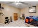 Simple bedroom with light tile floor and a ceiling fan at 1808 Walnut Ave, Las Vegas, NV 89101