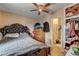 This bedroom features a ceiling fan, wood-look tile floors, ensuite bath and ample storage space at 1808 Walnut Ave, Las Vegas, NV 89101