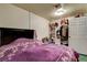 Bedroom featuring tile floors, a standard closet, and simple decor at 1808 Walnut Ave, Las Vegas, NV 89101