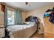 Bedroom features a ceiling fan and a large window that provides lots of natural light at 1808 Walnut Ave, Las Vegas, NV 89101