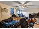 Standard bedroom with ceiling fan, window AC unit, and basic furnishings at 1808 Walnut Ave, Las Vegas, NV 89101