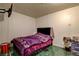 Cozy bedroom featuring tiled flooring and a comfortable queen-sized bed at 1808 Walnut Ave, Las Vegas, NV 89101