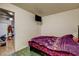 Bedroom featuring tile floors, ensuite bath and simple decor at 1808 Walnut Ave, Las Vegas, NV 89101