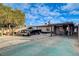 Attached covered carport and expansive driveway with ample parking on a sunny day at 1808 Walnut Ave, Las Vegas, NV 89101