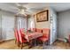 The bright dining room features tiled floors, a ceiling fan and outdoor access at 1808 Walnut Ave, Las Vegas, NV 89101