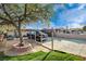 Spacious driveway with mature tree in the front yard of this cozy single-story home at 1808 Walnut Ave, Las Vegas, NV 89101