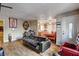 Cozy living room with wood-look floors, a comfortable couch, and natural light at 1808 Walnut Ave, Las Vegas, NV 89101