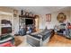 Cozy living room with wood-look floors, comfortable couch, and easy access to bedroom at 1808 Walnut Ave, Las Vegas, NV 89101