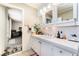 Bathroom featuring a large vanity with sink and ample counter space with white tile at 1920 Parkchester Dr, Las Vegas, NV 89108