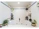 Bathroom featuring a large jacuzzi tub with dual shower heads and tiled surround at 1920 Parkchester Dr, Las Vegas, NV 89108
