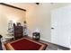 Bedroom featuring wood-look floors, a cozy rug, shelving unit, and modern nightstand at 1920 Parkchester Dr, Las Vegas, NV 89108