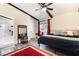 Bedroom featuring wood-look floors, ceiling fan, decorative beams and a bright window at 1920 Parkchester Dr, Las Vegas, NV 89108