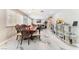 Charming dining area with stylish wooden chairs, with open access to the spacious living room at 1920 Parkchester Dr, Las Vegas, NV 89108
