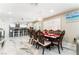 Elegant dining room with decorative chandelier and an open view to the modern kitchen at 1920 Parkchester Dr, Las Vegas, NV 89108