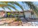 Charming front exterior of a home with mature landscaping and decorative walkway at 1920 Parkchester Dr, Las Vegas, NV 89108