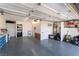 Spacious garage with epoxy floor, storage shelves, and ample workspace, perfect for projects at 1920 Parkchester Dr, Las Vegas, NV 89108
