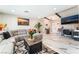 Cozy living room with a comfortable gray couch, stylish rug, and decorative beams at 1920 Parkchester Dr, Las Vegas, NV 89108