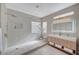 Bright bathroom with walk-in shower, double vanity, and modern finishes at 2602 Evening Sky Dr, Henderson, NV 89052