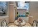 Charming courtyard with outdoor seating, decorative table, potted plants, and stylish accents at 2602 Evening Sky Dr, Henderson, NV 89052