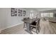 Inviting dining room with wood table and chairs, complemented by modern wall art at 2602 Evening Sky Dr, Henderson, NV 89052