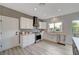 Well-lit kitchen featuring stainless appliances and grey backsplash at 2602 Evening Sky Dr, Henderson, NV 89052