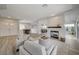Spacious living area with an open layout, modern fireplace, and stylish furnishings throughout at 2602 Evening Sky Dr, Henderson, NV 89052