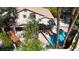An aerial view showcases this property's lush backyard, sparkling pool, and well-maintained landscaping at 3047 Whispering Crest Dr, Henderson, NV 89052