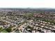 Panoramic aerial view of a residential neighborhood with well-maintained streets and access to a nearby golf course at 3047 Whispering Crest Dr, Henderson, NV 89052
