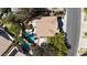 An aerial view showcases this property's lush backyard, sparkling pool, and well-maintained landscaping at 3047 Whispering Crest Dr, Henderson, NV 89052
