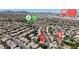 A wide aerial view of a residential neighborhood with a park and the proximity of Henderson Executive Airport at 3047 Whispering Crest Dr, Henderson, NV 89052