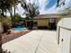 This home features a private backyard with a pool, patio, basketball hoop and shed at 3047 Whispering Crest Dr, Henderson, NV 89052