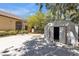 Backyard features a shed, mature landscaping and a basketball court perfect for active enjoyment at 3047 Whispering Crest Dr, Henderson, NV 89052