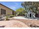 Backyard featuring mature landscaping, shed, sport court and view of home's exterior at 3047 Whispering Crest Dr, Henderson, NV 89052