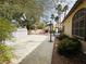This backyard features a basketball court, pool, mature landscaping, shed and tall palm trees at 3047 Whispering Crest Dr, Henderson, NV 89052