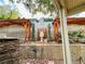 The backyard features a retaining wall, a fountain and mature landscaping at 3047 Whispering Crest Dr, Henderson, NV 89052