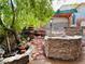 Beautiful backyard with a stone patio and a charming pergola at 3047 Whispering Crest Dr, Henderson, NV 89052