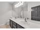 Bathroom features double vanity, large mirror, and dark cabinets at 3047 Whispering Crest Dr, Henderson, NV 89052