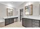 Dual sink bathroom vanity with granite countertop, framed mirror, and decorative lighting and a door to a closet at 3047 Whispering Crest Dr, Henderson, NV 89052