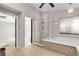 Bathroom with soaking tub, separate shower and tile accents at 3047 Whispering Crest Dr, Henderson, NV 89052