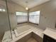 Bathroom features a soaking tub under a pair of windows providing natural light at 3047 Whispering Crest Dr, Henderson, NV 89052