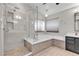 Luxurious bathroom with glass-enclosed shower, soaking tub, and modern fixtures at 3047 Whispering Crest Dr, Henderson, NV 89052