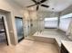 Bright bathroom features a glass shower and soaking tub with decorative tile and a large window at 3047 Whispering Crest Dr, Henderson, NV 89052