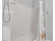 Clean bathroom featuring a white tiled shower and a shower curtain at 3047 Whispering Crest Dr, Henderson, NV 89052