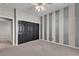 Bedroom with carpet, striped accent wall, ceiling fan, and ample closet space at 3047 Whispering Crest Dr, Henderson, NV 89052