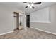 The well-lit bedroom features tile floors, a ceiling fan, mirrored closet doors and a large window at 3047 Whispering Crest Dr, Henderson, NV 89052