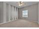 Bedroom featuring plush carpet, ceiling fan, and bright window at 3047 Whispering Crest Dr, Henderson, NV 89052