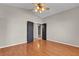 Bright bedroom showcasing wood floors, neutral walls, and a ceiling fan at 3047 Whispering Crest Dr, Henderson, NV 89052