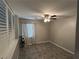 Cozy bedroom with neutral decor, window with shutters and ceiling fan at 3047 Whispering Crest Dr, Henderson, NV 89052