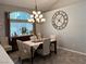 Charming dining room featuring a chandelier, large window, and tasteful decor at 3047 Whispering Crest Dr, Henderson, NV 89052
