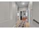 Hallway with wood and carpet and many doors to the bedrooms at 3047 Whispering Crest Dr, Henderson, NV 89052